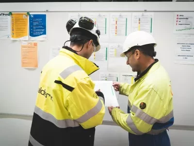Employees at the plant read safety guidelines