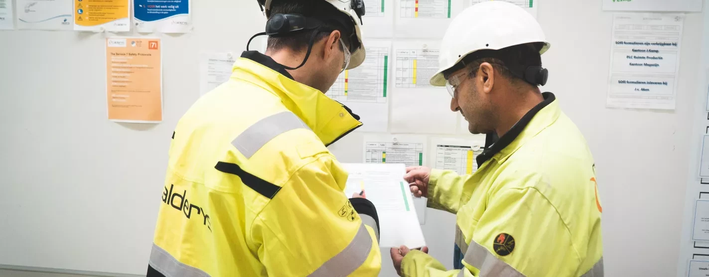 Employees at the plant read safety guidelines