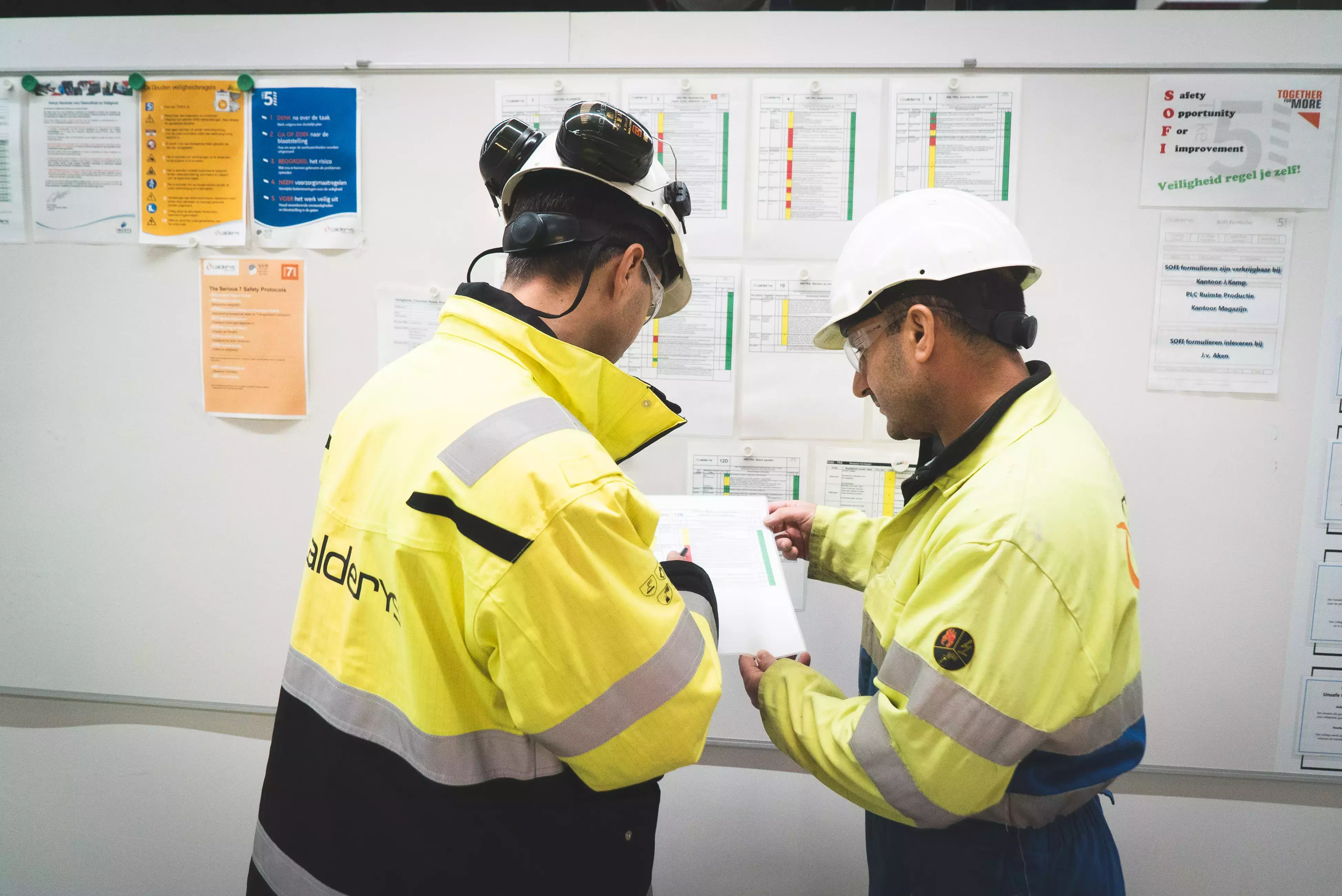 Employees at the plant read safety guidelines